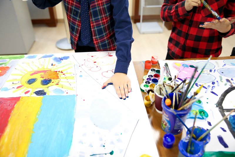 kids doing arts and craft project with paper